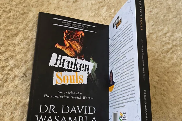 A copy of Broken Souls opened to show the front and back covers.