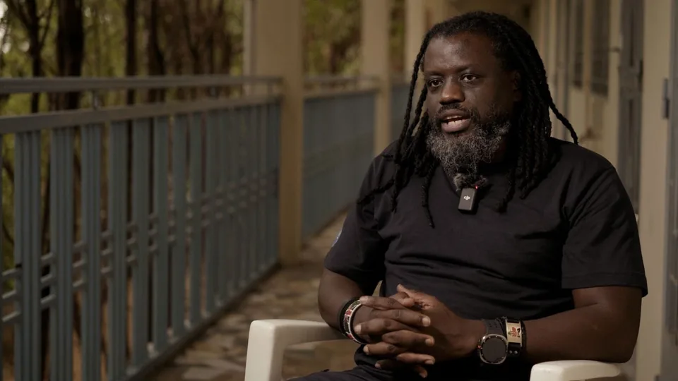 Dr. David Wasambla speaking during a Humanitarian Chronicles interview.